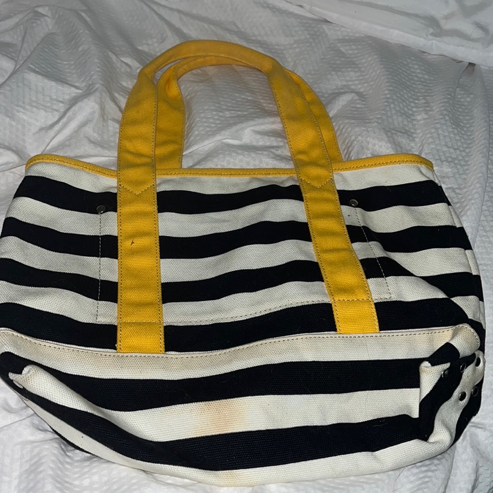 J Crew blue and white striped bag with yellow hand